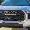Celestial Silver 2022 Toyota Tundra with the Fog Lamp Bezel Overlay and Mustache Grille Overlay installed, presenting a complete front-end customization.