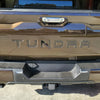 2022 Toyota Tundra rear bumper with BumperShellz installed in smoked mesquite, showcasing the finished look.