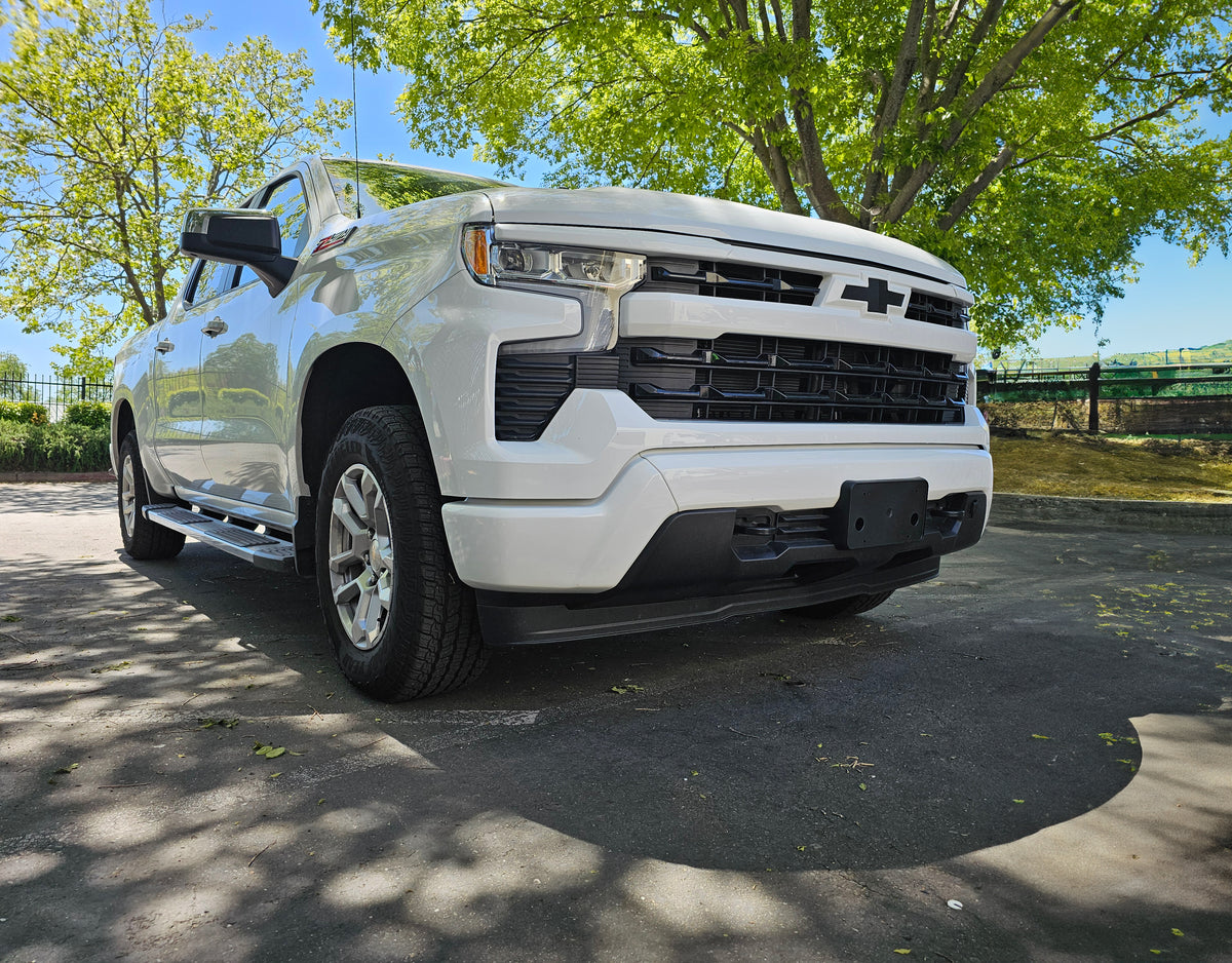 Hero image of a 2022-2024 Chevy Silverado 1500 featuring a gloss white shellz chrome delete kit installed