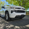 Hero image of a 2022-2024 Chevy Silverado 1500 featuring a gloss white shellz chrome delete kit installed