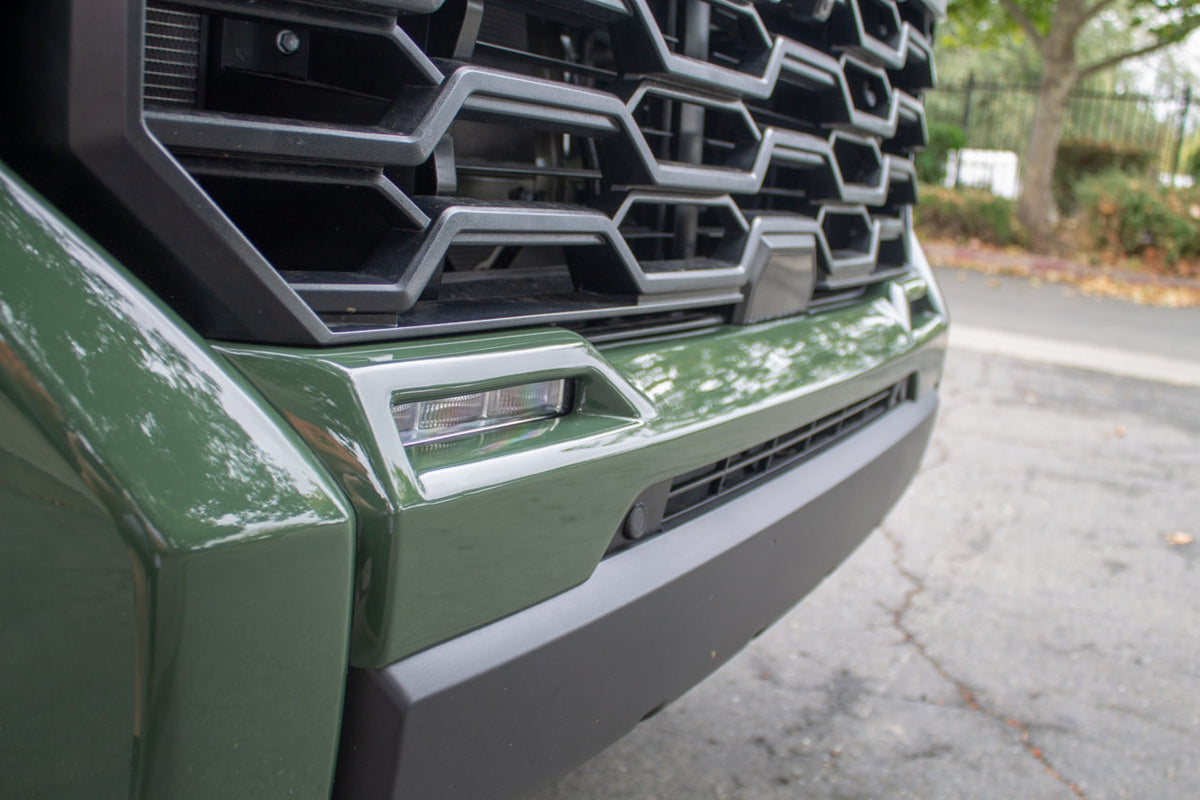 2022-2024 Toyota Tundra featuring the Fog Lamp Bezel Overlay in army green, fully installed, showcasing how the product complements the vehicle's rugged aesthetic.