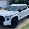 Shellz installed on a 2022-2024 Toyota Tundra grille surround, mustache chrome delete