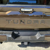 2022 -2024 Toyota Tundra rear bumper with BumperShellz installed in smoked mesquite, showcasing the finished look.