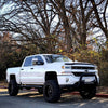 showing off BumperShellz 2016-2018 Chevy Silverado 1500 - Front BUMPERSHELLZ™ installed on a gloss white truck