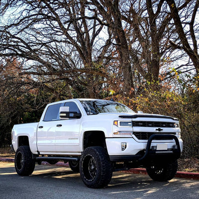 showing off BumperShellz 2016-2018 Chevy Silverado 1500 - Front BUMPERSHELLZ™ installed on a gloss white truck