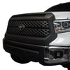 Front and side view at a 45-degree angle of a Toyota Tundra, showcasing Matte Black BumperShellz overlays on the grille surround and hood bulge.