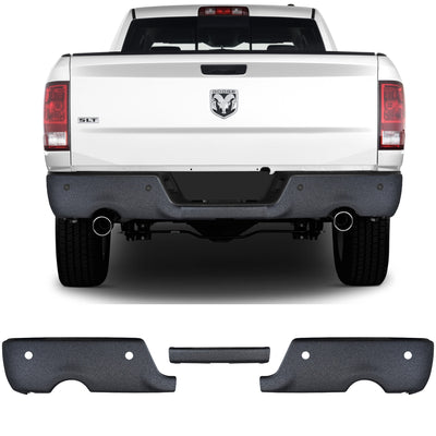 Armor Coated 2009-2018 RAM BumperShellz dual exhaust cut-outs, with parking sensors installed on a truck