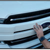 Gloss White Center Bar Grille Overlay in the process of installation on a 2018-2020 F150 grille, demonstrating the ease of adding a chrome delete look.