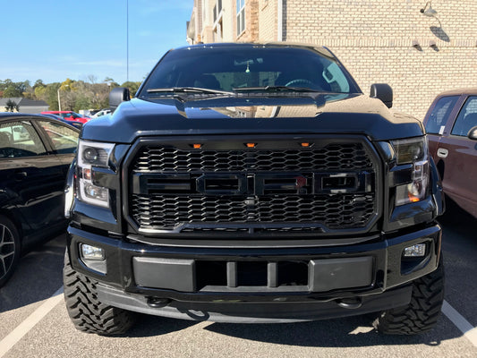 Gloss Black Front Bumper Covers installed on a 2015-2017 Ford F-150, Full Chrome Delete Kit