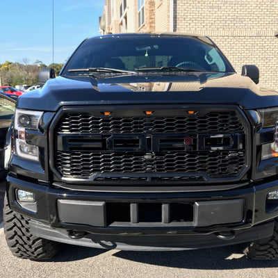 Gloss Black Front Bumper Covers installed on a 2015-2017 Ford F-150, Full Chrome Delete Kit