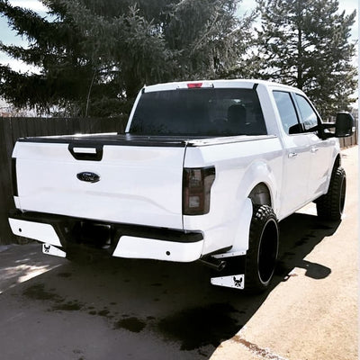 Gloss white Rear BumperShellz for 2015-2020 Ford F-150, with parking sensor hole cutouts, installed on a Ford F-150