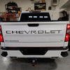 Summit White BumperShellz installed on a on a 2019-2024 Chevy Silverado 1500 LT, chrome delete