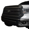 Front and side view at a 45-degree angle of a 2014-2021 Toyota Tundra, showcasing Matte Black BumperShellz overlays on the grille surround and hood bulge.